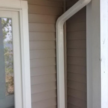 White 6 inch gutter with large downspout